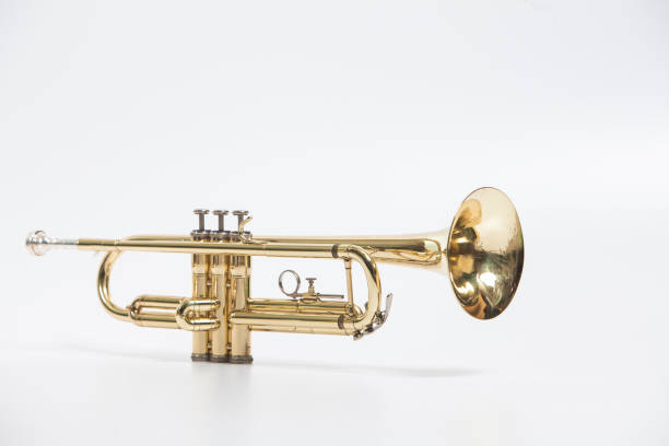 istock Gold lacquer trumpet with mouthpiece isolated on white 897714586
