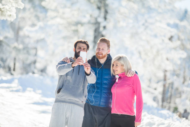 istock Three sportspeople taking selfie 897717024