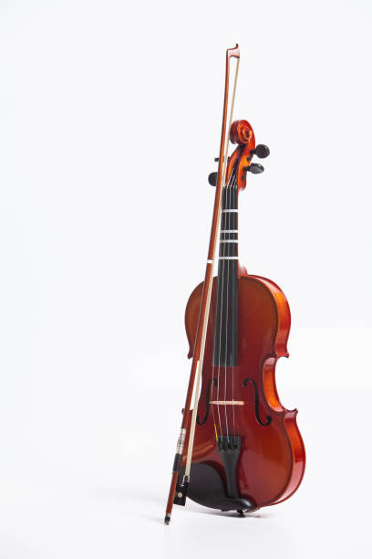 istock Stand of violin with bow isolated on white 897717050
