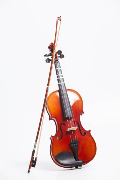 istock Stand of violin with bow isolated on white 897717078