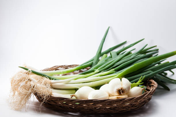 istock Welsh onions and onions in a big wood dish 897717212