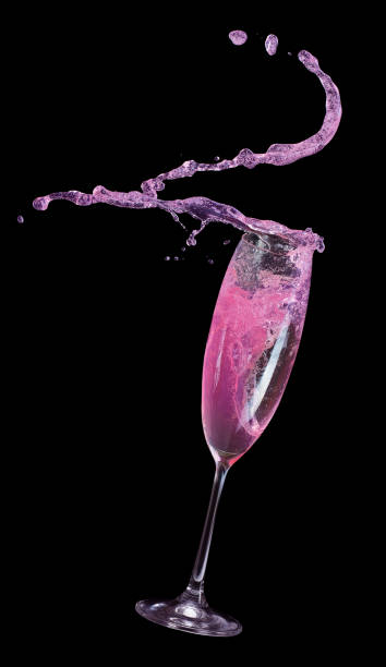 istock pink champagne splash on a black background 897718288