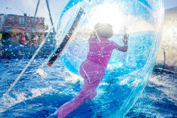 Photo of Girl Inside Walking Ball