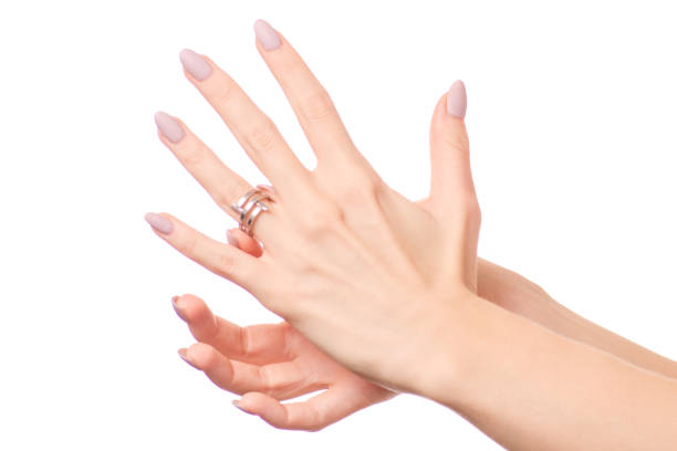 istock Female hand holding a silver ring bijouterie isolated 897745500