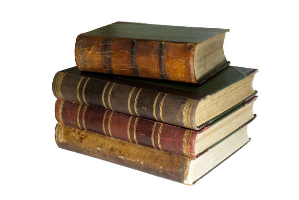 a stack of old books isolated A stack of four ancient books isolated old book stock pictures, royalty-free photos & images