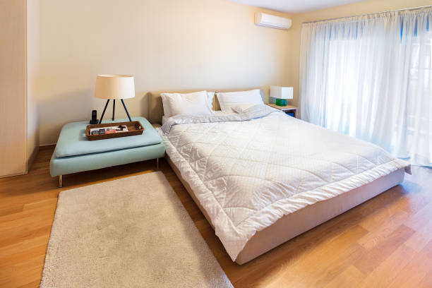 istock A modern bedroom with king size bed on oak floor. 897778476