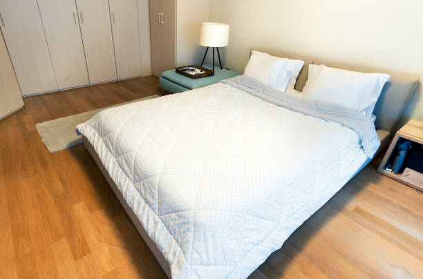 istock A modern bedroom with king size bed on oak floor. 897778492