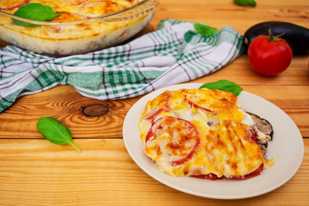 istock Eggplant casserole. Moussaka on wooden background 897784462