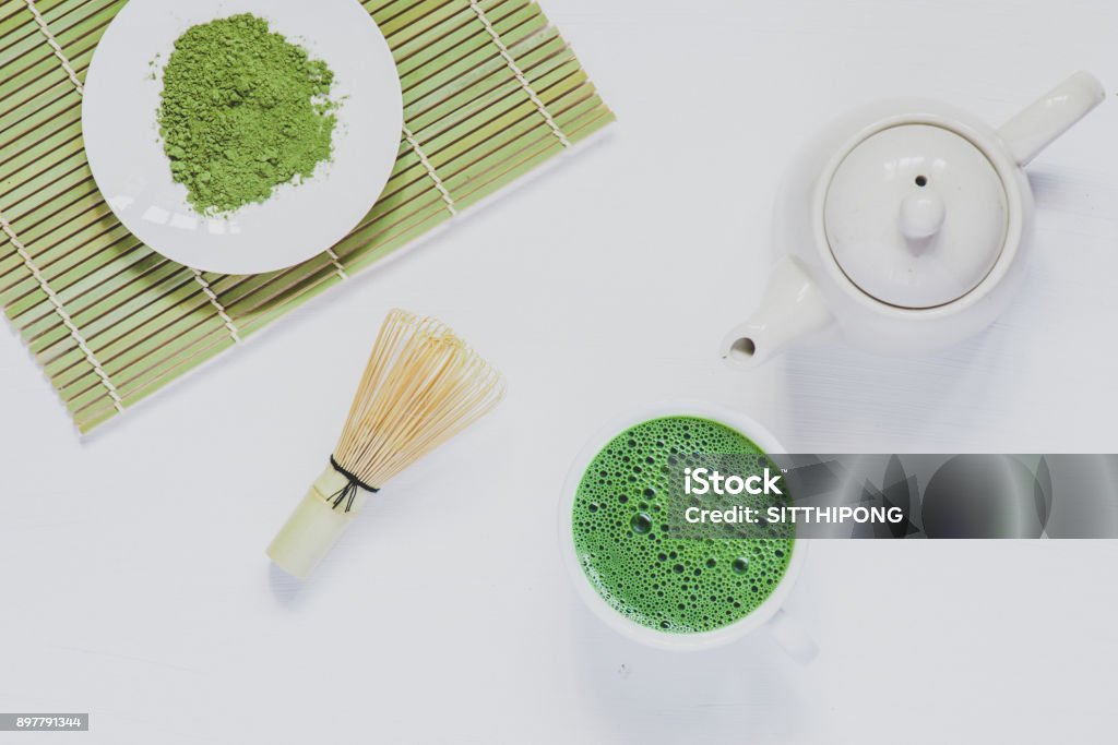 Matcha green tea on white wood Cream - Dairy Product Stock Photo