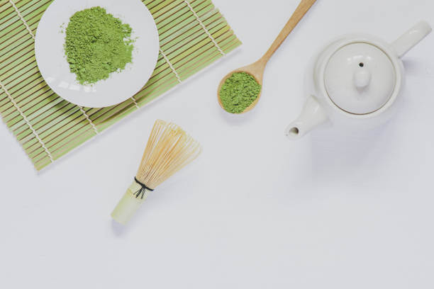 istock Matcha green tea on white wood 897791596