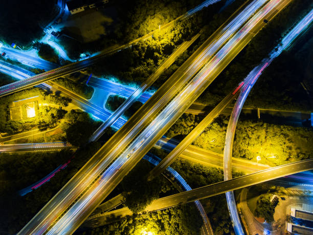 istock Aerial highway junction at night time 897796586