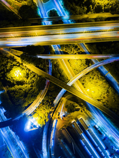 istock Aerial highway junction at night time 897796592