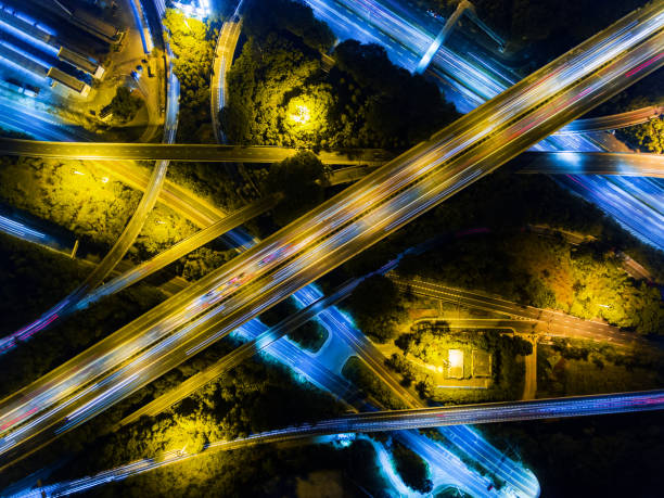 istock Aerial highway junction at night time 897796594