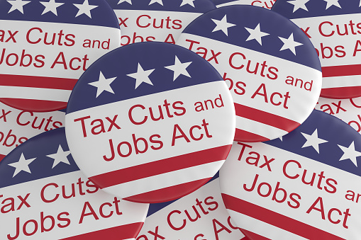USA Politics News Badges: Pile of Tax Cuts And Jobs Act Buttons With US Flag, 3d illustration