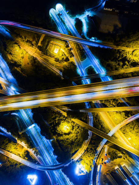 istock Aerial highway junction at night time 897805942