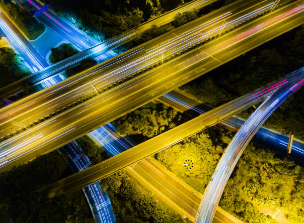 istock Aerial highway junction at night time 897805988
