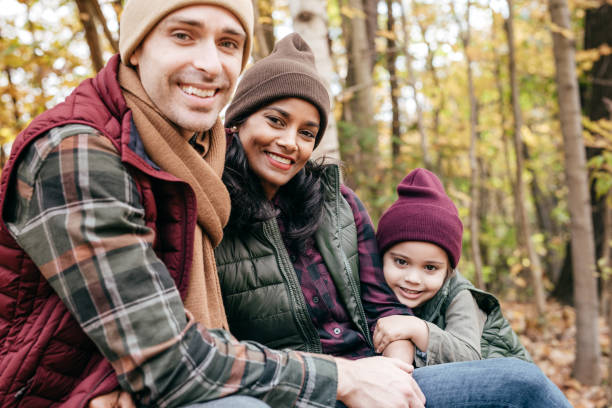istock Parents and daughter in the park 897806488