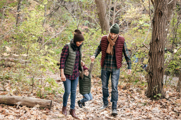 istock Parents and daughter in the park 897806494