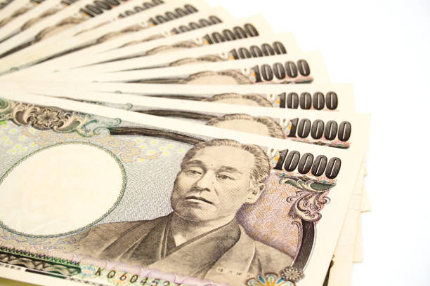 istock Japanese 10,000 Yen Banknotes on White Background 897811906