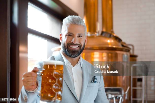 Micro Brewery Owner With A Mug Of Fresh Beer Stock Photo - Download Image Now - Adult, Adults Only, Alcohol - Drink