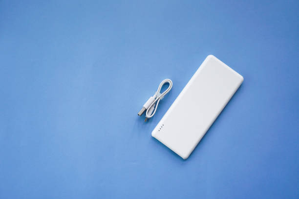 istock White Power Bank on Blue Background Top View 897814088