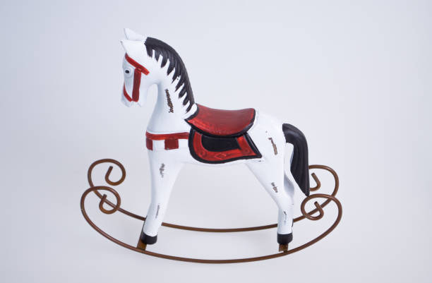 istock Swinging horse toy on white background 897821572