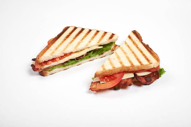 istock fresh sandwich close up with vegetables and meat isolated on white background 897829630