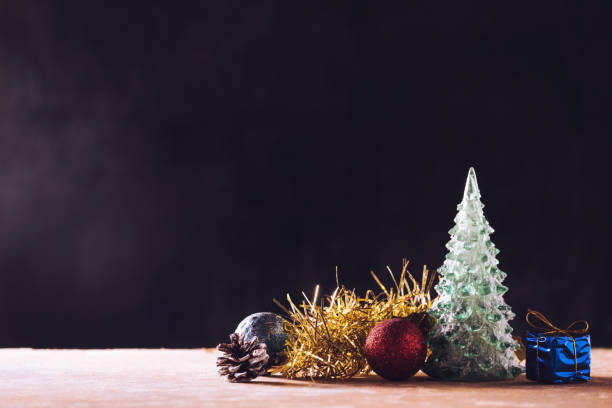 istock Christmas decorations on the wooden table, black background, free space for text 897837302
