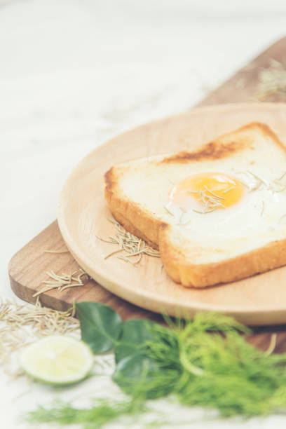 istock A healthy breakfast consisting of fried eggs, bread, vegetables and coffee.A healthy breakfast consisting of fried eggs, bread, vegetables and coffee. 897844866