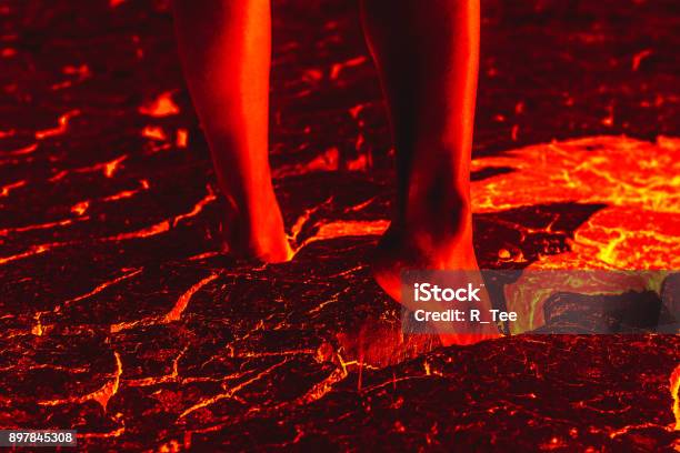 Foot On The Lava Floor Because Of Global Warming Stock Photo - Download Image Now - Foot, Burning, Fire - Natural Phenomenon