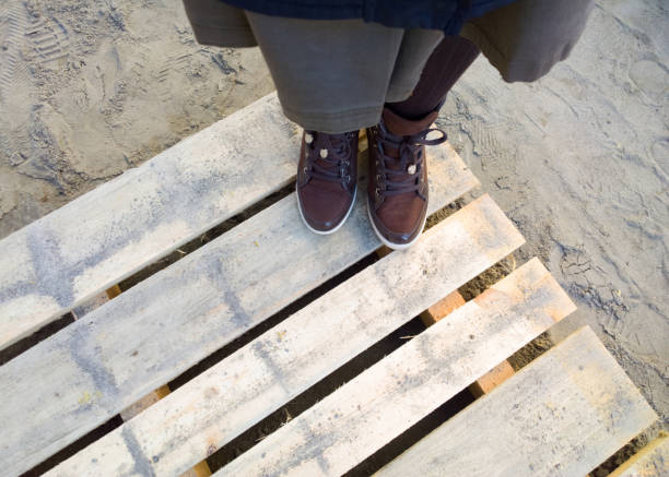 istock Feet on the pallet. 897865438