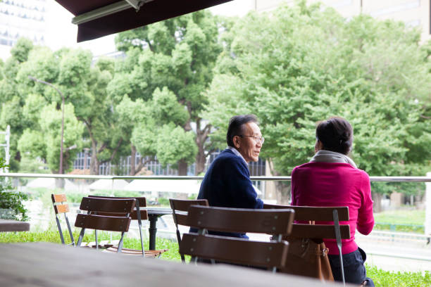 istock A senior citizen who drinks tea at a sidewalk cafe. 897865826