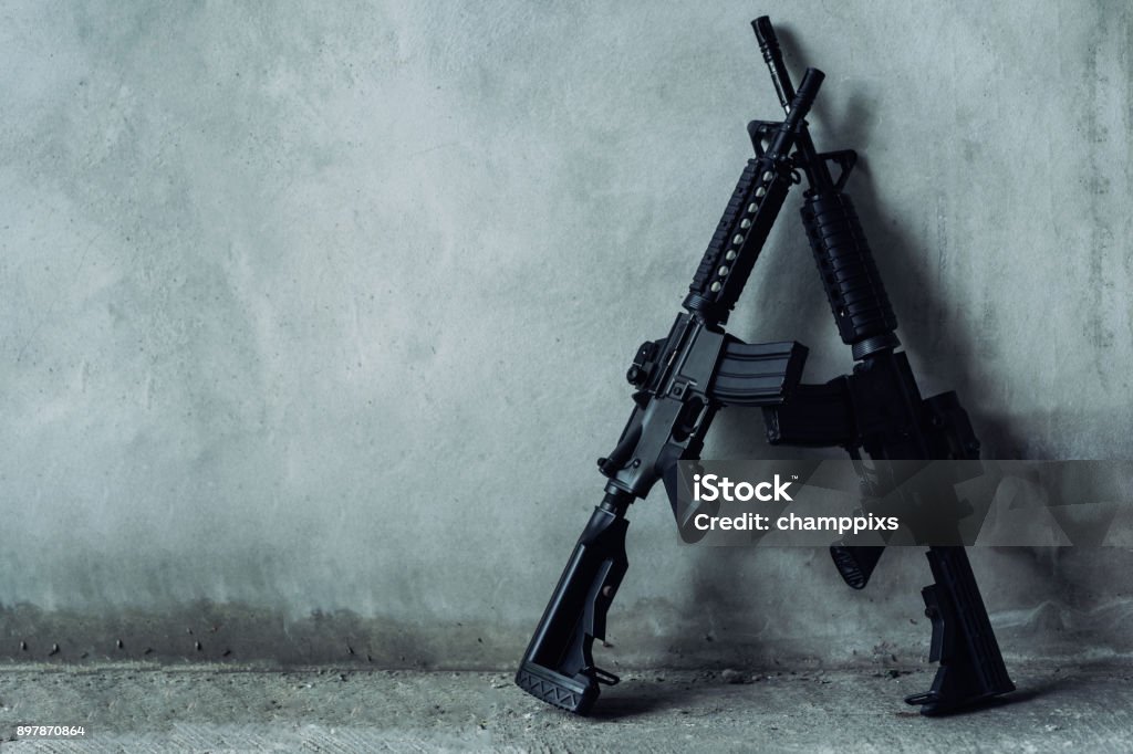 Double assault rifle on gray background, terrorist,robber concept. Weapon Stock Photo