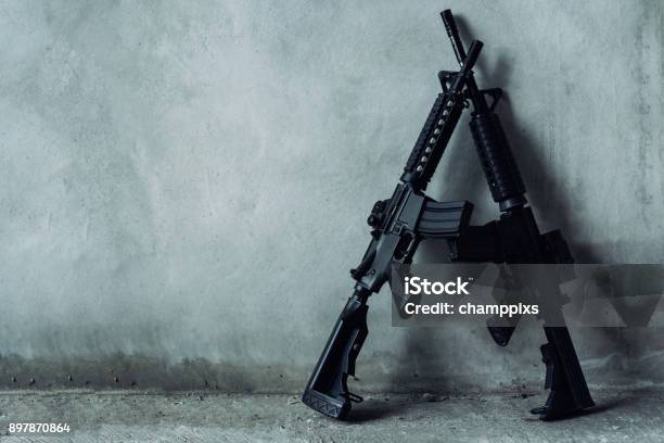 Double Assault Rifle On Gray Background Terrorist Robber Concept Stock Photo - Download Image Now