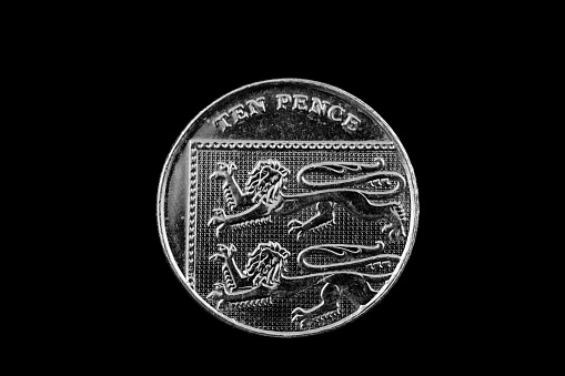 A British ten pence coin isolated on a black background