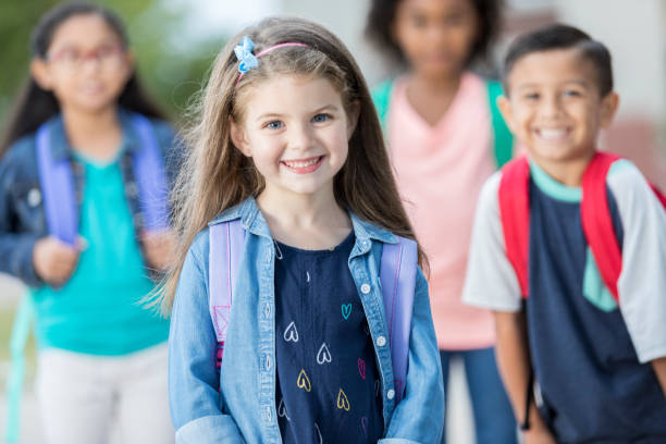 istock Adorable schoolgirl ready for school 897885420