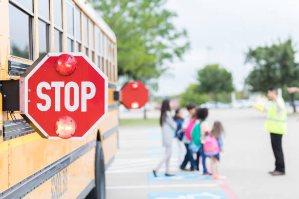 istock Close up of stop sign on school bus 897885422