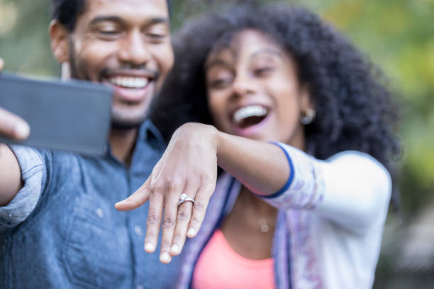 Young woman shows off engagement ring