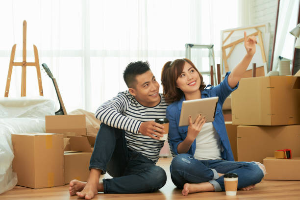 istock Young couple in new apartment 897890158