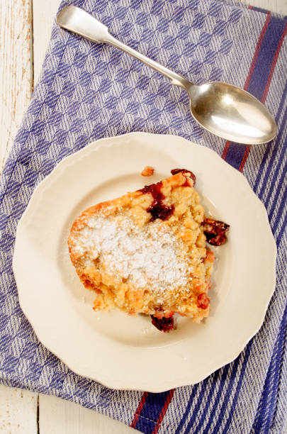 istock home made cherry crumble with powdered sugar on a plate 897916138