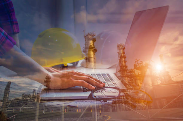 istock Double exposure of engineer meeting for architectural project and working with partner engineering on workplace of oil and gas refinery concept. 897925490