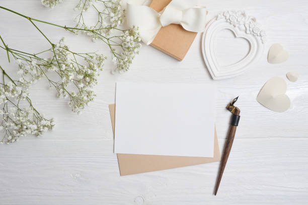 istock mockup Letter with a calligraphic pen greeting card for St. Valentine's Day in rustic style with place for your text, Flat lay, top view photo 897927628