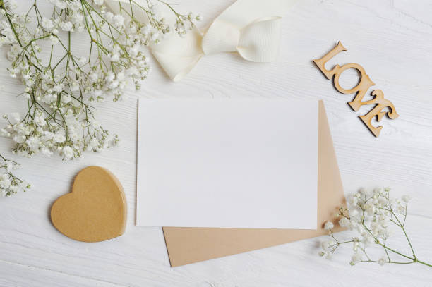istock mockup Letter with a calligraphic pen greeting card for St. Valentine's Day in rustic style with place for your text, Flat lay, top view photo mock up 897927912