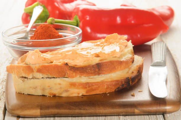 paprika spread on a slice of bread and ground powder