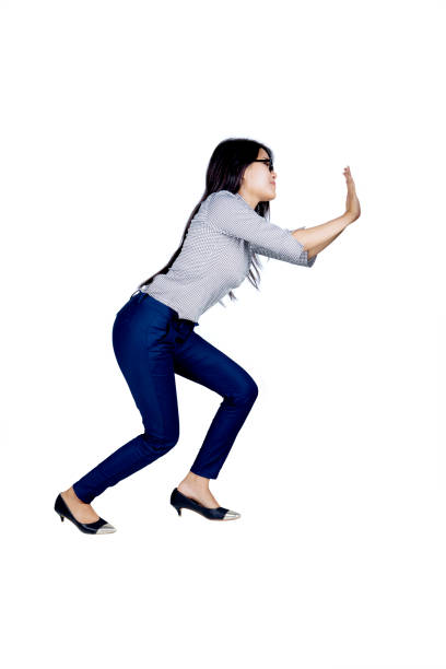 istock Beautiful businesswoman push something on studio 897937374