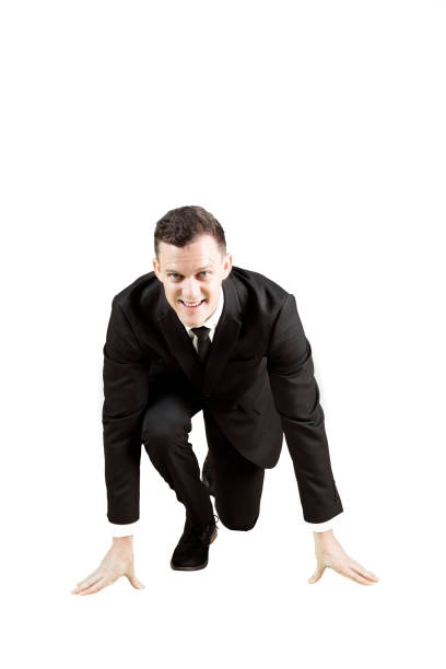 istock American businessman in ready position to run 897948032