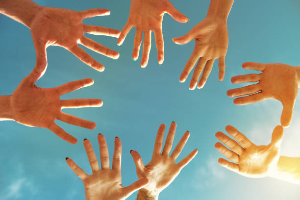 istock Team teamwork or friendship concept with many hands in circle 897948300