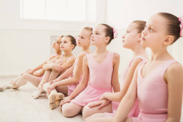 istock Little ballerinas in ballet studio 897950554