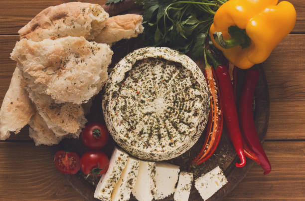 istock Homemade indian soft cheese paneer with herbs 897954984