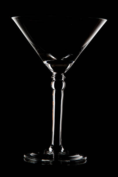 istock Martini glass on black background with rim lighting 897957784